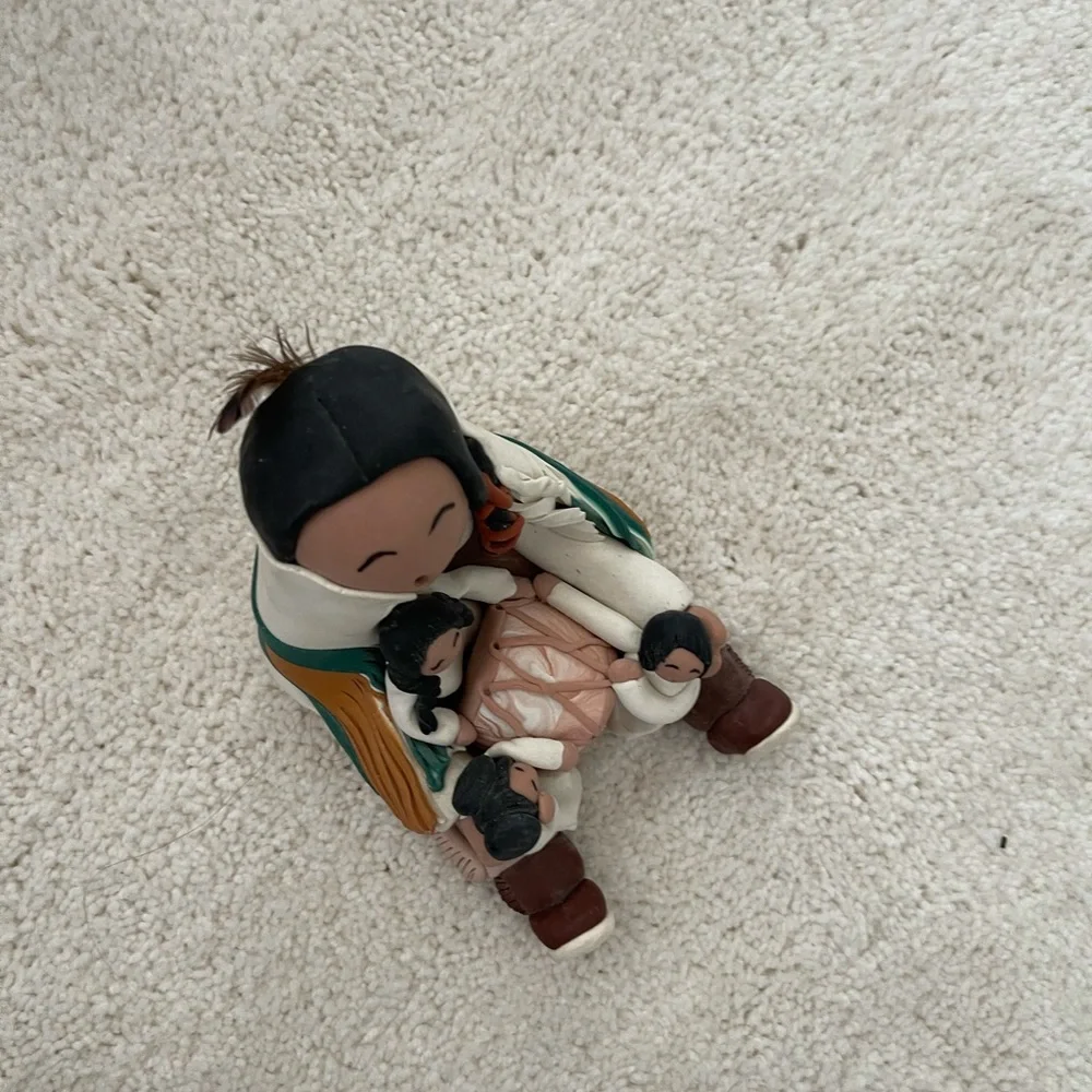 Signed piece of Native American clay folk art
